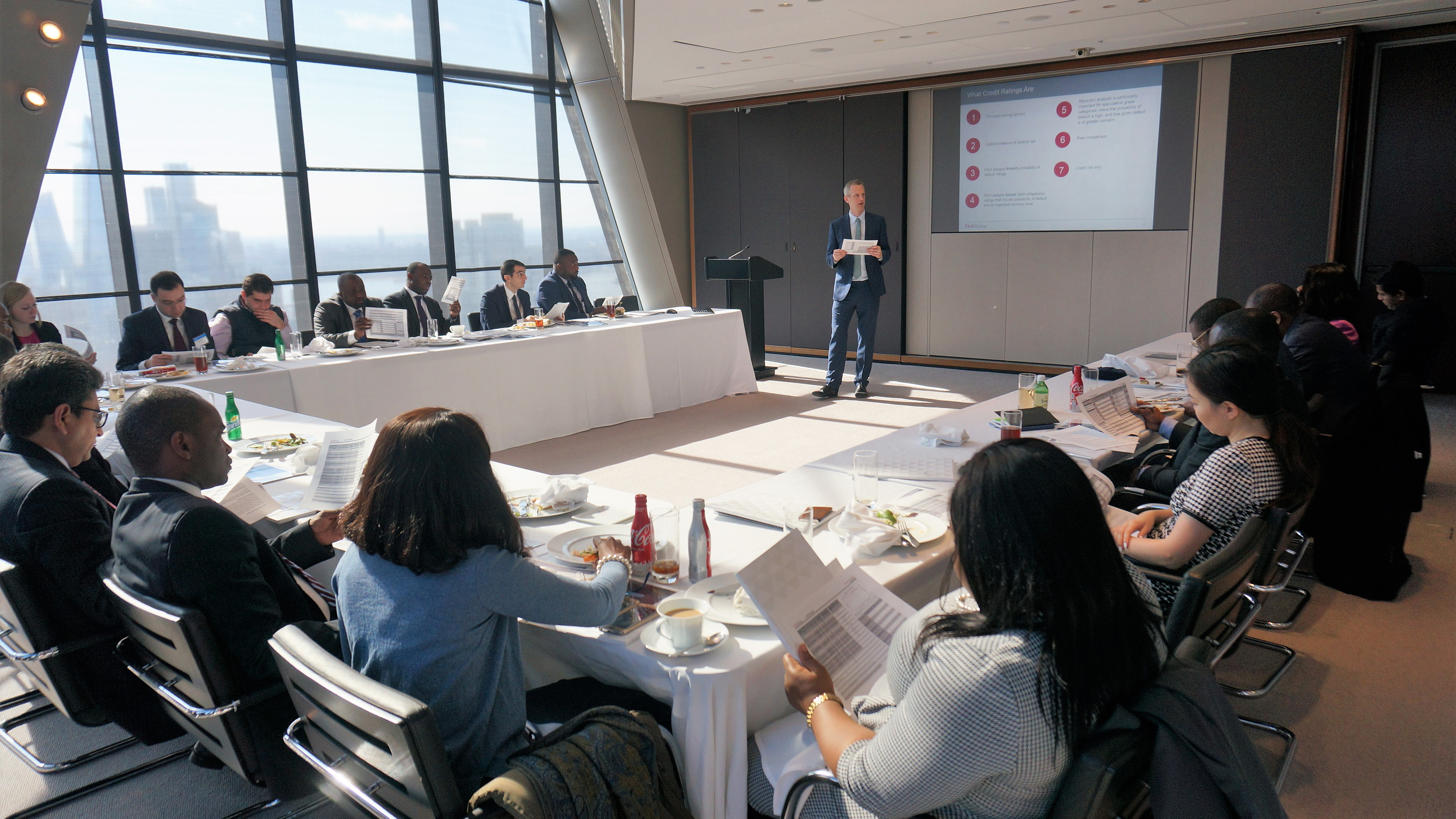 several people watching a presentation in a conference room
