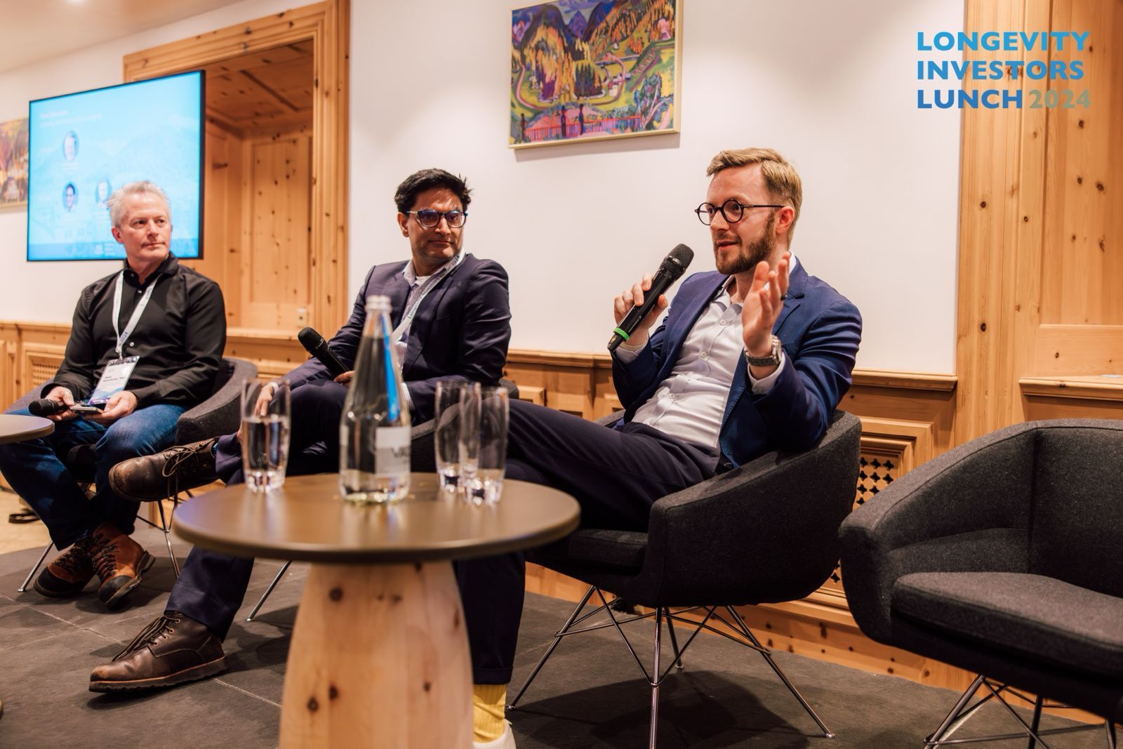 Ahuja (middle) speaking at the Longevity Investors Lunch.